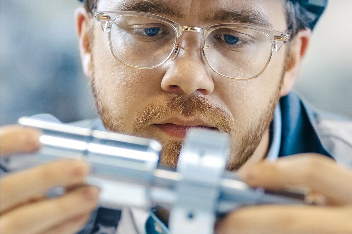 Engineer inspecting a part