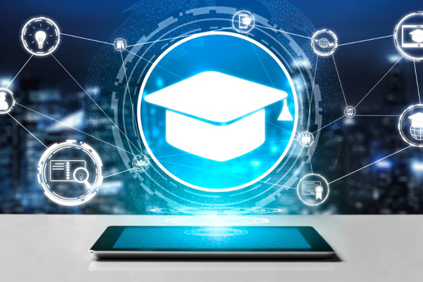 image of a grad hat over a computer