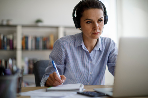 woman at computer with headset