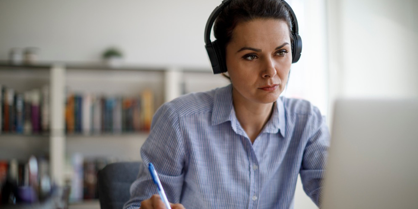 woman at computer with headset