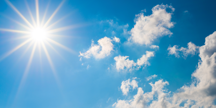 image of a blue sky with clouds and sun