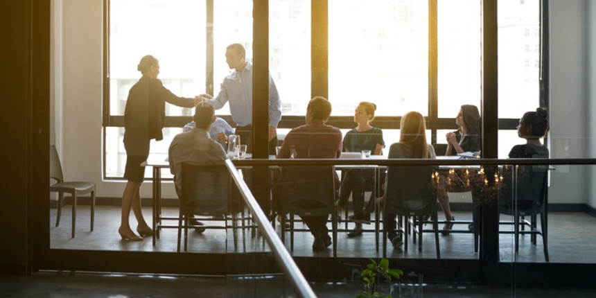 a group of people in a meeting room