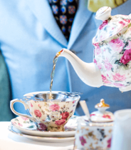 stock photo of a tea pot teacup pouring tea