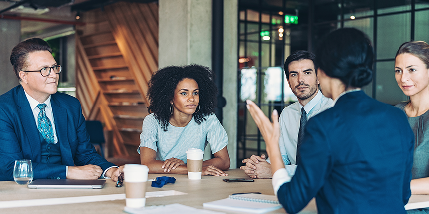 Engineering Life Leadership image of people sitting around a table 4x2