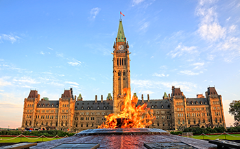 The image prominently features Parliament with a tall clock tower, and in the foreground, there is the eternal flame.