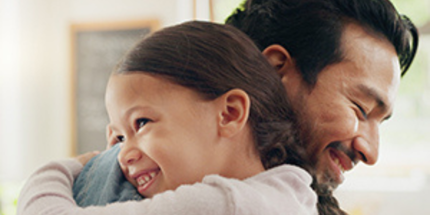 Image of a father and child hugging