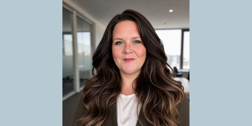 A professional headshot of Laura Paul from Engineers Canada. She is smiling slightly and has long, wavy brown hair, pictured in a modern office setting with large windows in the background.