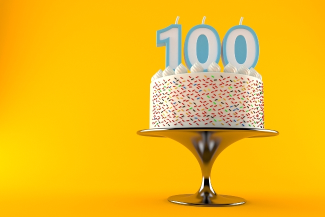 a cake with candles showing 100