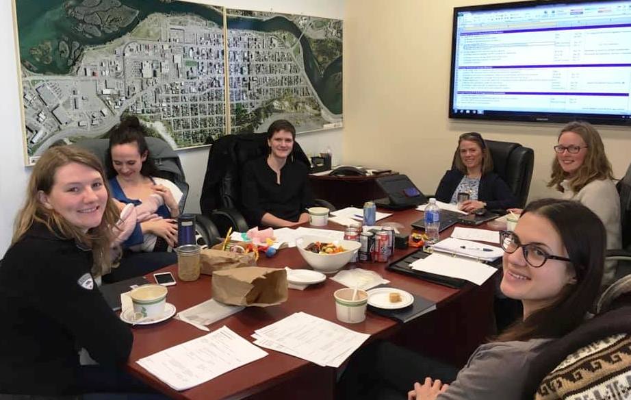 group of women around a table working