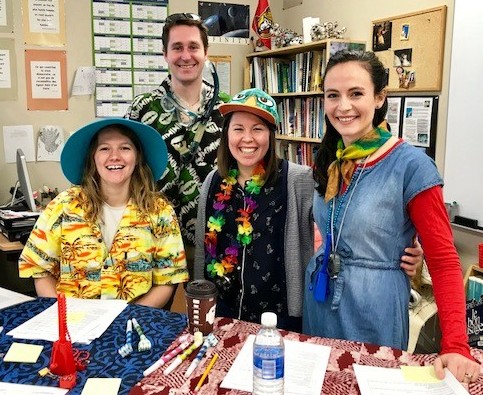 diversity; group of people smiling in rainbow colours