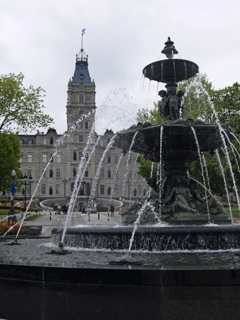 fountain and old city buildings
