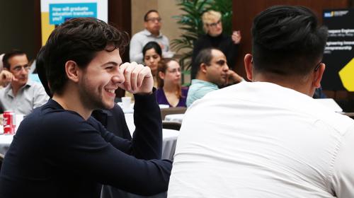 Students smiling during a group lecture