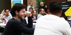 Students smiling during a group lecture
