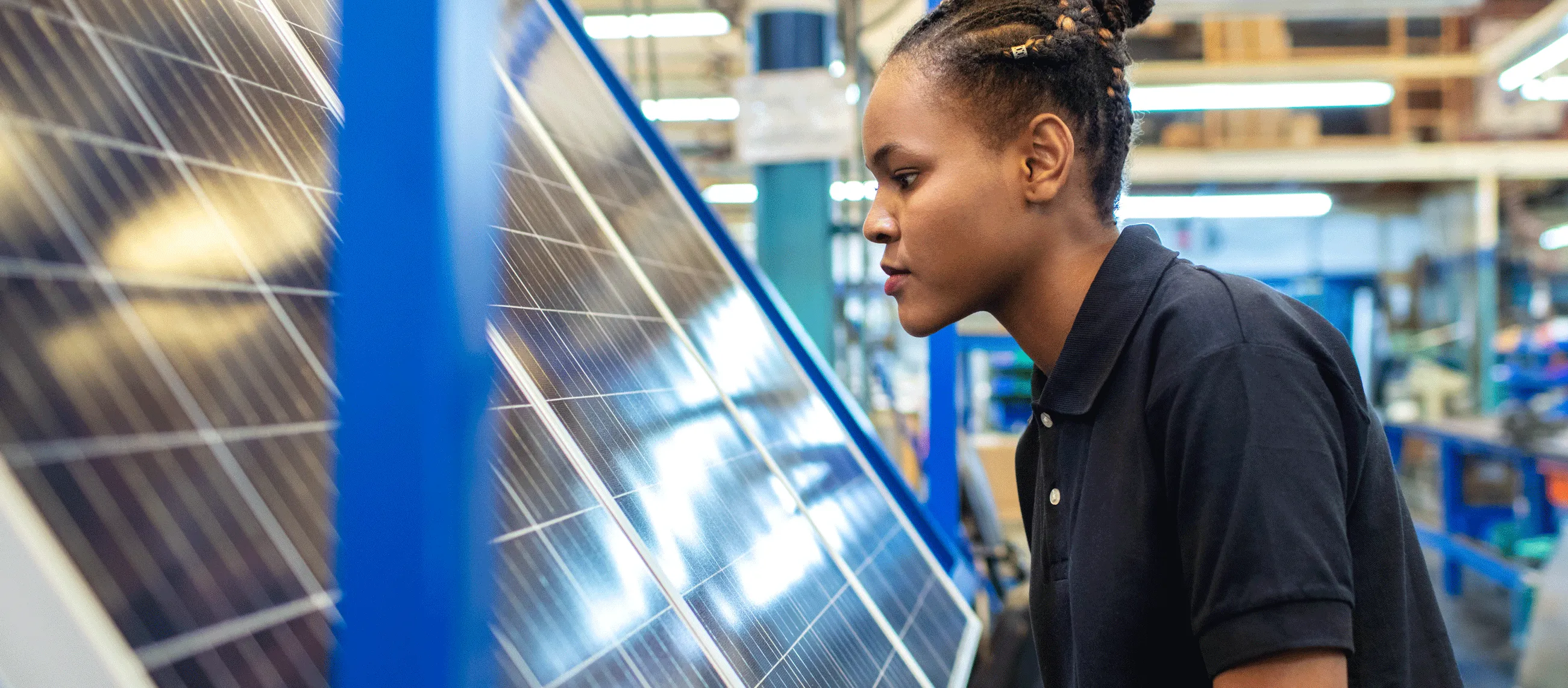 Person inspecting solar panels