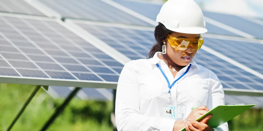woman reading from clipboard with hardhat