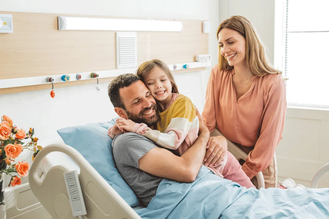 Family supporting each other in hospital room