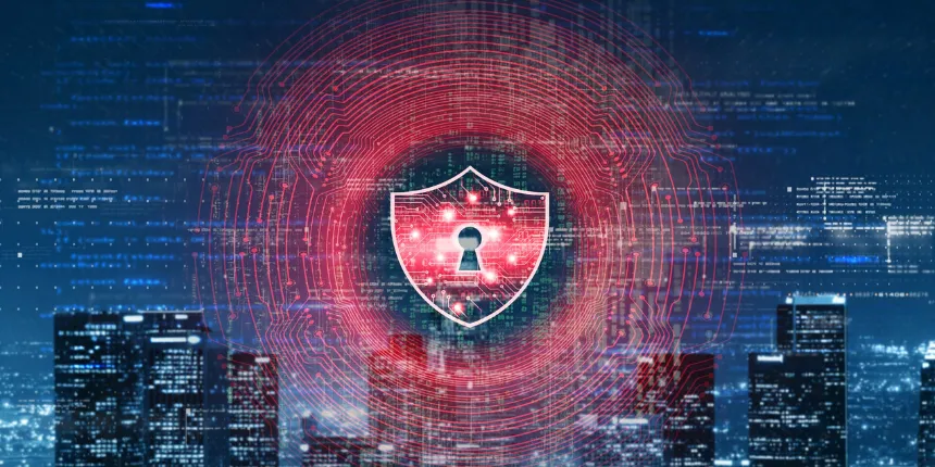 A digital concept image representing cybersecurity, showing a glowing red security shield with a keyhole overlaid with circular digital circuitry and binary data above an illuminated modern cityscape at night.